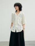 SUNYVONNE Rhombus Hollow Loose Short Sleeve Shirt