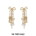 SUMIYAK Bow Tassel Earrings