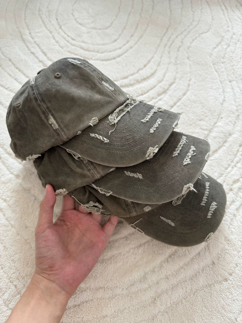 Erole Stains and Damages Baseball Caps