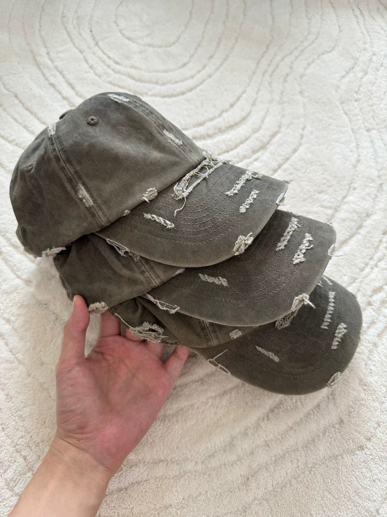 Erole Stains and Damages Baseball Caps