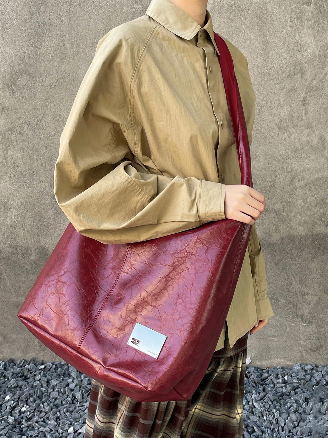 CryingCenter Crack Glossy Oil Wax Crossbody Bag